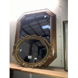 An octagon wooden framed mirror and an oval gilt framed mirror,