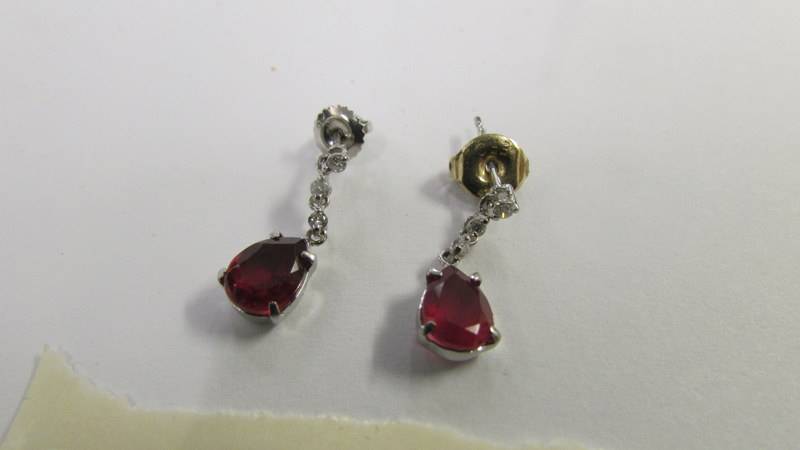 A pair of 14ct white gold and ruby earrings. - Image 3 of 3