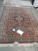 A 257 x 170 cm rug including fringe.