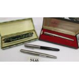 A Conway Stewart boxed ink pen and pencil, a boxed Parker pen and 2 others.