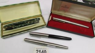 A Conway Stewart boxed ink pen and pencil, a boxed Parker pen and 2 others.