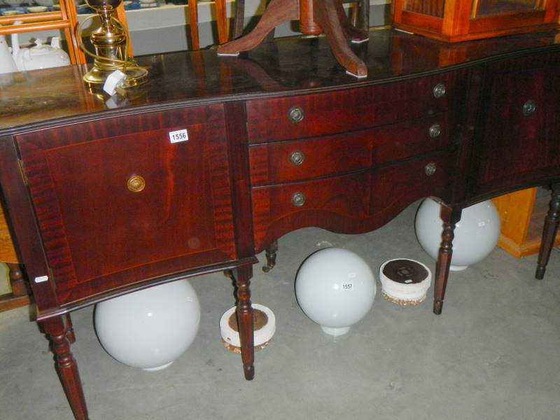 A dark wood stained sideboard