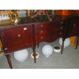 A dark wood stained sideboard