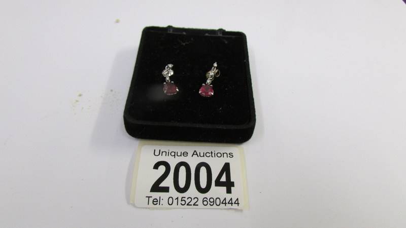 A pair of 14ct white gold and ruby earrings. - Image 2 of 3