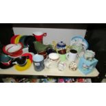 A mixed lot of cups, bowls, teapots etc., including colourful melamine.