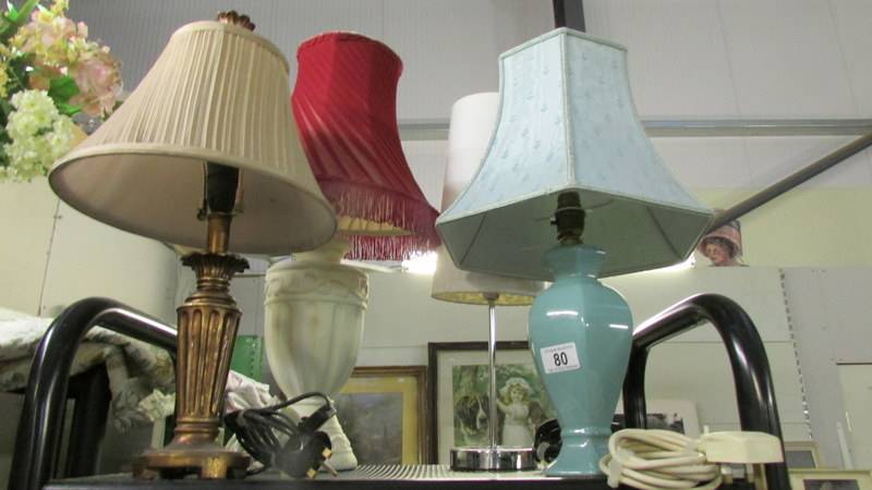 4 assorted table lamps.