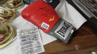 An Everlast Riddick Bowe signed boxing glove with certificate.