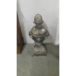 A cream coloured crazed stoneware pineapple finial (70 cm tall on 33 cm square base)
