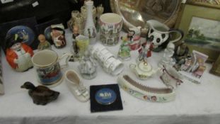 A mixed lot including figures, tankards. etc.