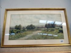 A gilt framed countryside scene watercolour signed George Oyston