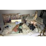 A quantity of interesting items including vintage babies shoes, linen, small wicker basket,