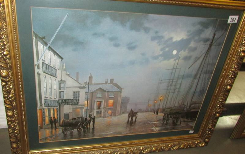 A gilt framed harbour scene print