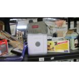 A shelf of miscellaneous items including calculators, air purifier etc.
