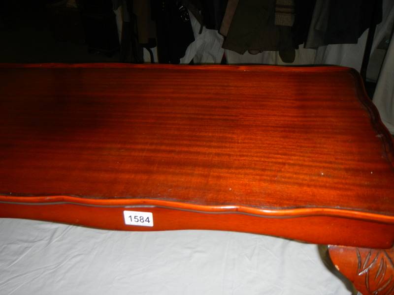 A dark wood stained long coffee table. - Image 2 of 2