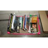 A box of books on cars and travel etc.