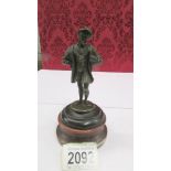 A bronze figure of a nobleman, possibly an explorer or astronomer, 19th century.