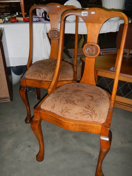 A pair of Edwardian dining chairs on Queen Anne legs