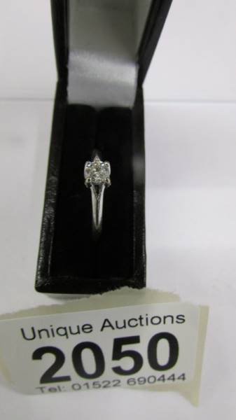 A diamond single stone ring set in 9ct white gold, 0.25 ct, size J.