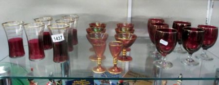 A quantity of cranberry drinking glasses,