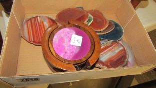 A quantity of cut and polished semi-precious and agate stone coasters.