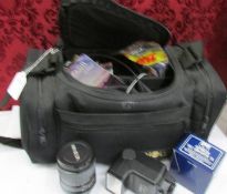 A Minolta camera case with a lens, a flash and an auto tele converter.