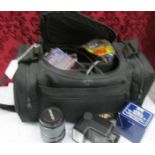 A Minolta camera case with a lens, a flash and an auto tele converter.