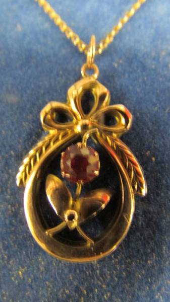 An early 20th century rose gold pendant surmounted with a ribbon stone set, - Image 2 of 2