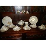 A Crinonline lady vintage 22 piece teaset (milk jug is stained inside)