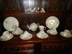 A Crinonline lady vintage 22 piece teaset (milk jug is stained inside)