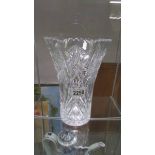 A large cut glass vase.
