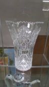 A large cut glass vase.