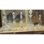 A pair of cut glass decanters and 3 others.