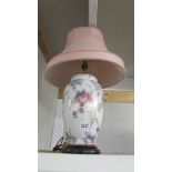 A Chinese style table lamp with shade.