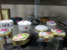 A collection of pill boxes etc in porcelain, cloisonne, wood etc.