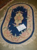 A 165 x 110 cm rug.