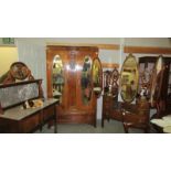 A Victorian mahogany three piece bedroom suite comprising triple mirror dressing table,