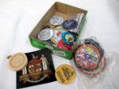 A selection of collectable pin badges and patches