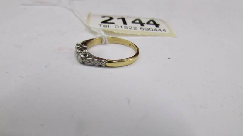 A three stone 20 pt 18ct yellow gold diamond ring, size N, total 2.5 g. - Image 2 of 2