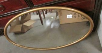 A good oval gilt framed mirror.