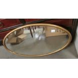 A good oval gilt framed mirror.