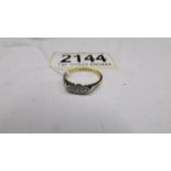 A three stone 20 pt 18ct yellow gold diamond ring, size N, total 2.5 g.