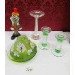 A pair of glass candlesticks, one other, a hand painted tea light and a glass clown.