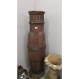 A two part tall art deco chimney pot (resembles a rocket) 135 cm tall, maximum diameter 38 cm.