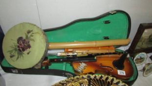 A violin and other musical instruments.