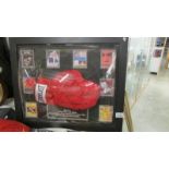 A framed and glazed signed boxing glove with certificate.