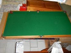 A table top snooker board.