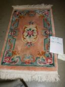 A 180 x 84 cm rug.