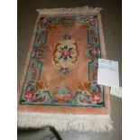 A 180 x 84 cm rug.