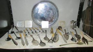 A mixed lot of silver plate flatware, brass cat etc.