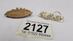 A 9ct gold name brooch 'Maggie' and a Mother brooch.